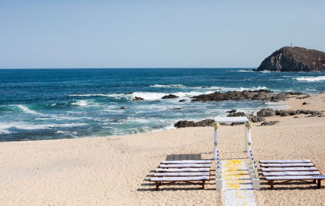 Beach view with wedding arch and seating