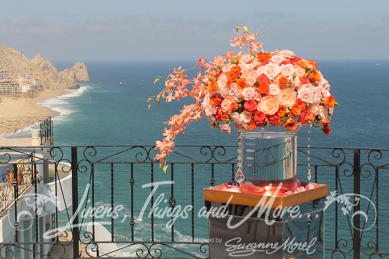 Vase of flowers with ocean in background